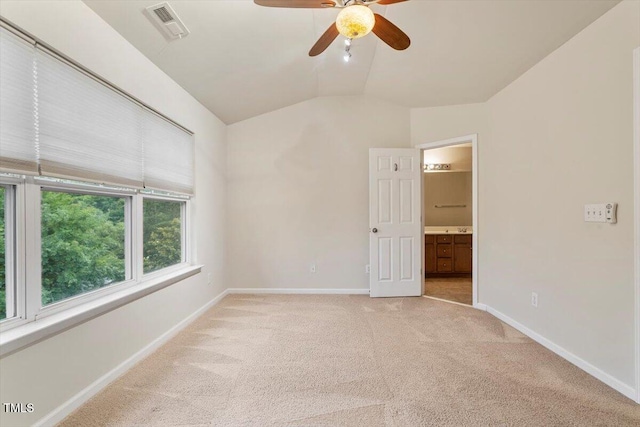 615 Carlton Commons Ln, Cary, NC 27519 - spare room featuring light carpet, a ceiling fan, baseboards, and vaulted ceiling