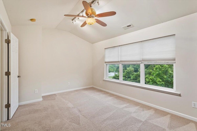 615 Carlton Commons Ln, Cary, NC 27519 - empty room featuring vaulted ceiling, light carpet, baseboards, a ceiling fan, and a smoke detector