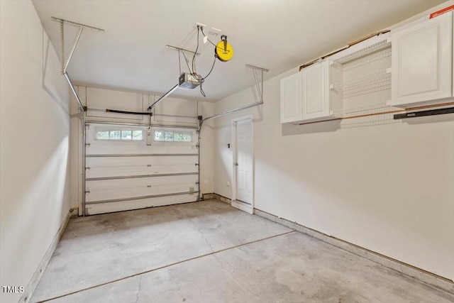 615 Carlton Commons Ln, Cary, NC 27519 - garage featuring baseboards and a garage door opener