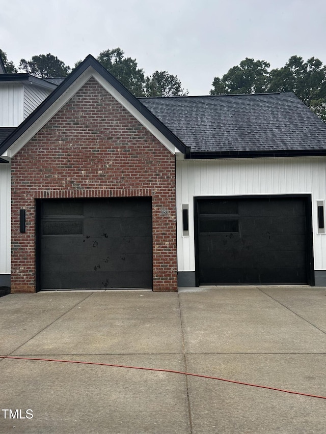 123-125 Ottawa Dr, Louisburg, NC 27549 - view of side of home featuring driveway, roof with shingles, brick siding, and a garage