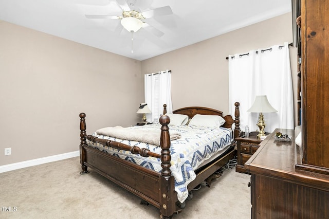 1454 Spring Pond Rd, Nashville, NC 27856 - bedroom featuring light carpet, baseboards, and a ceiling fan