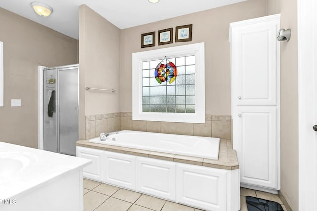 1454 Spring Pond Rd, Nashville, NC 27856 - full bathroom featuring tile patterned floors, a bath, and a stall shower