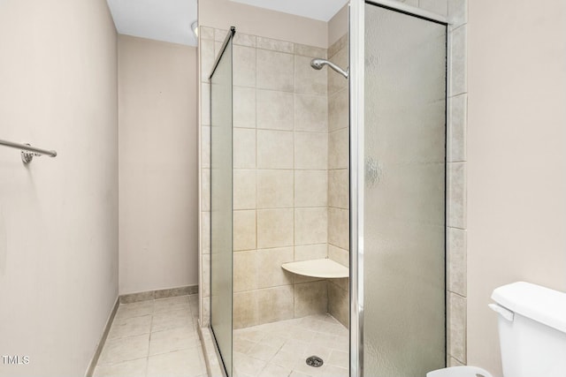 1454 Spring Pond Rd, Nashville, NC 27856 - bathroom featuring tile patterned floors, toilet, and a stall shower
