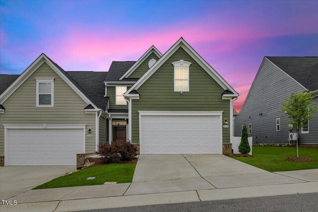 518 Judge Ct, Durham, NC 27703 - traditional-style home featuring concrete driveway, an attached garage, and a front yard