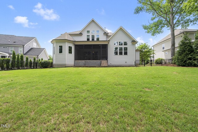 back of house featuring a sunroom