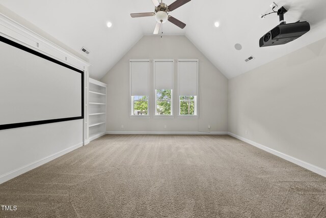 cinema featuring ceiling fan, lofted ceiling, baseboards, light carpet, and recessed lighting