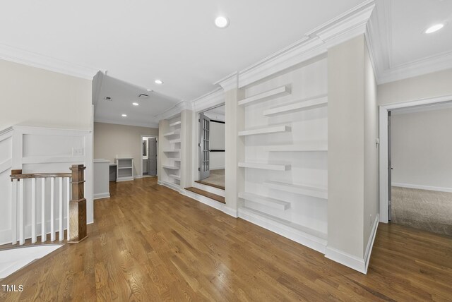 interior space with wood finished floors, recessed lighting, built in shelves, and baseboards