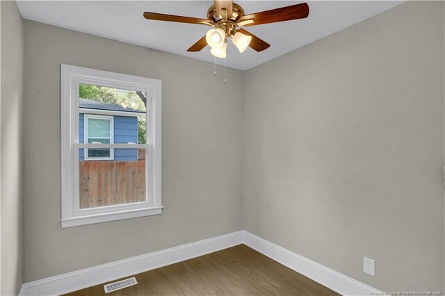 213 Judd St, Fayetteville, NC 28305 - spare room with dark wood finished floors, baseboards, a ceiling fan, and visible vents