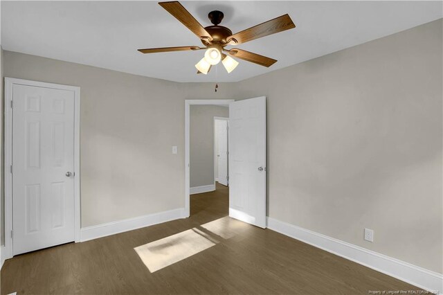 213 Judd St, Fayetteville, NC 28305 - unfurnished bedroom with ceiling fan, baseboards, and wood finished floors