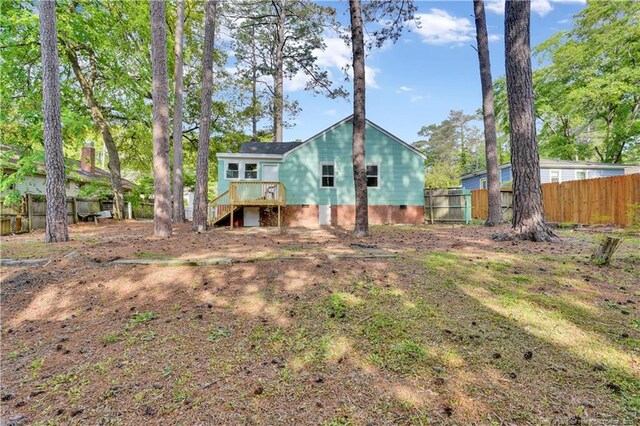 213 Judd St, Fayetteville, NC 28305 - rear view of house featuring fence and stairs