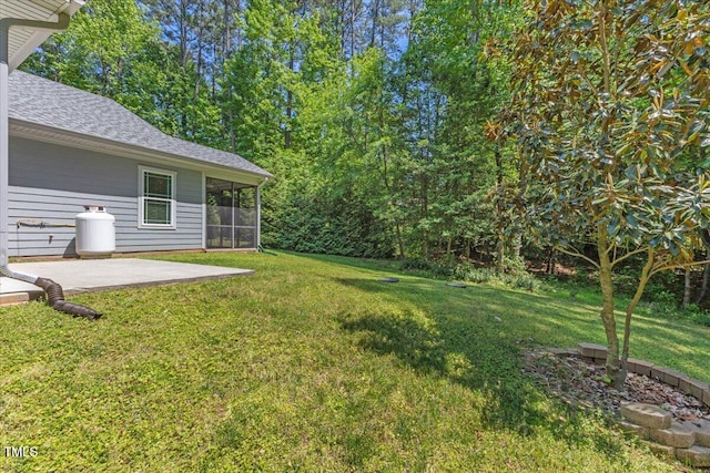 205 Sacred Fire Rd, Louisburg, NC 27549 - view of grassy yard with a sunroom and a patio area