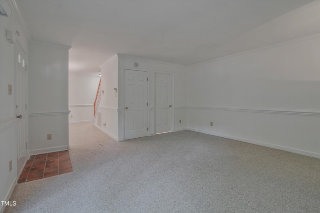 carpeted empty room featuring ornamental molding
