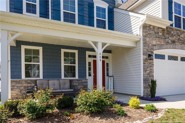 entrance to property with stone siding and covered porch
