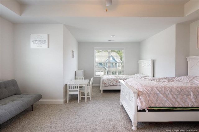bedroom featuring carpet and baseboards