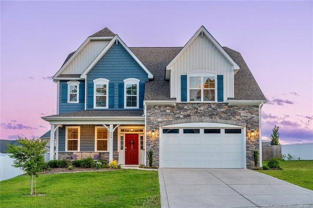 429 Letterfearn Dr, Fayetteville, NC 28311 - craftsman-style house with driveway, stone siding, covered porch, board and batten siding, and an attached garage