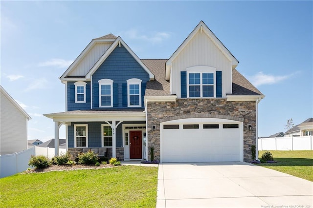429 Letterfearn Dr, Fayetteville, NC 28311 - craftsman-style house with stone siding, covered porch, driveway, and a garage