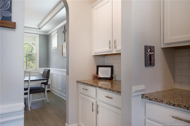 429 Letterfearn Dr, Fayetteville, NC 28311 - kitchen featuring ornamental molding, wood finished floors, white cabinets, stone countertops, and backsplash