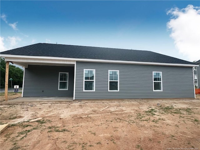 back of property with a patio