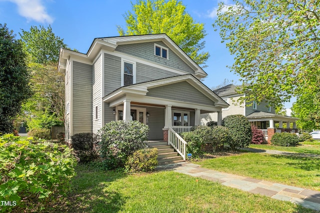 104 E Wilson St, Mebane, NC 27302 - american foursquare style home with a porch and a front yard