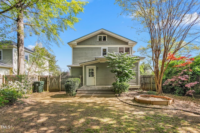 104 E Wilson St, Mebane, NC 27302 - rear view of house featuring a gate