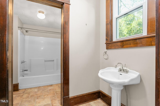 104 E Wilson St, Mebane, NC 27302 - bathroom featuring washtub / shower combination and stone finish flooring