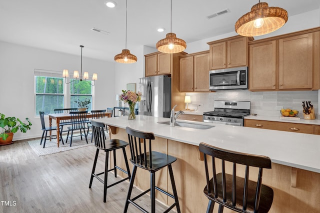 1501 Addison Lake St, Fuquay Varina, NC 27526 - kitchen with backsplash, visible vents, stainless steel appliances, and a sink