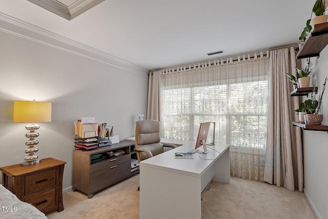 office space with baseboards, crown molding, and light colored carpet