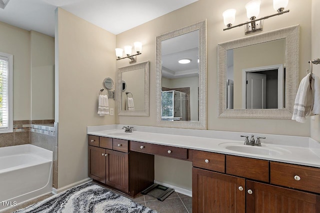 bathroom featuring a shower stall, a sink, double vanity, a garden tub, and tile patterned flooring