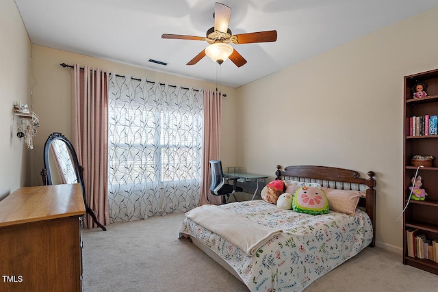 bedroom featuring visible vents, ceiling fan, and carpet flooring