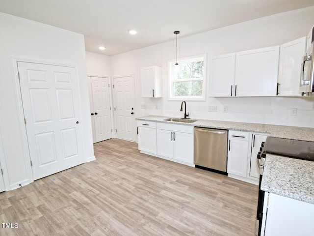 48 S Grace Way, Henderson, NC 27537 - kitchen featuring white cabinets, light wood-type flooring, appliances with stainless steel finishes, and a sink