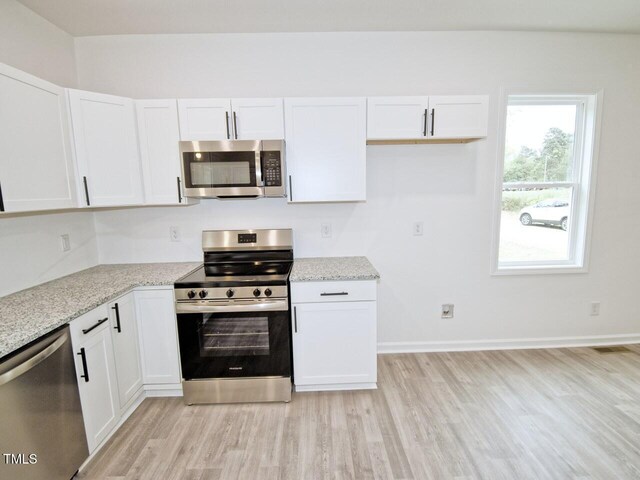48 S Grace Way, Henderson, NC 27537 - kitchen with light wood finished floors, appliances with stainless steel finishes, and white cabinetry