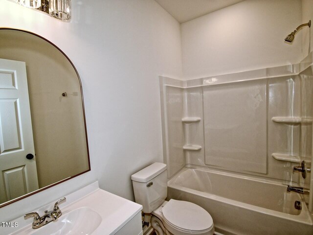 48 S Grace Way, Henderson, NC 27537 - bathroom with toilet, vanity, and washtub / shower combination