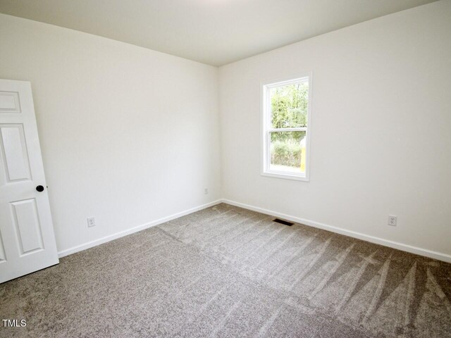 48 S Grace Way, Henderson, NC 27537 - spare room featuring carpet floors, visible vents, and baseboards