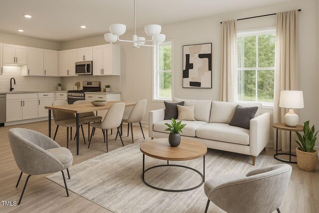 48 S Grace Way, Henderson, NC 27537 - living area featuring recessed lighting, light wood-style flooring, and a notable chandelier