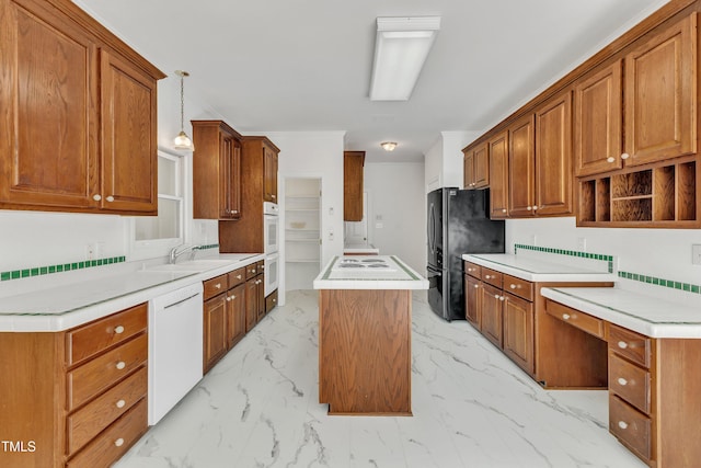 kitchen with a sink, white appliances, marble finish floor, pendant lighting, and a kitchen island