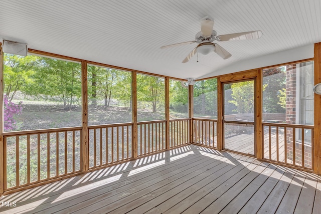unfurnished sunroom featuring ceiling fan