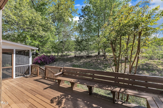 wooden terrace featuring a sunroom