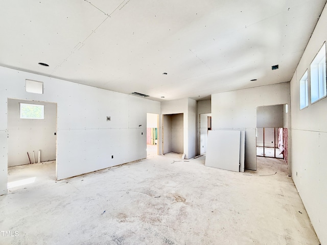 unfurnished room featuring a wealth of natural light