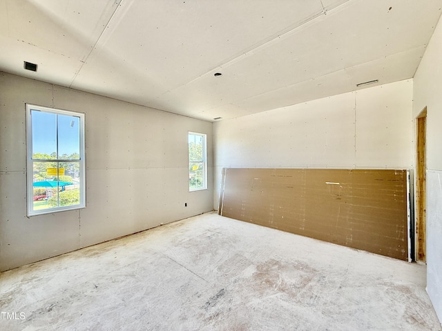 empty room featuring unfinished concrete flooring