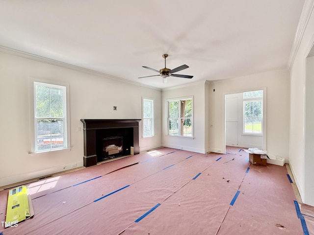 3817 Coach Lantern Ave, Wake Forest, NC 27587 - unfurnished living room featuring plenty of natural light, ornamental molding, a fireplace with flush hearth, and a ceiling fan