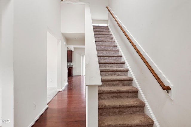 3513 Diamond Springs Dr, Raleigh, NC 27610 - staircase with wood finished floors and baseboards