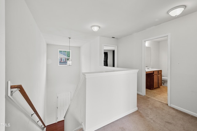 3513 Diamond Springs Dr, Raleigh, NC 27610 - corridor featuring baseboards, an upstairs landing, and light colored carpet
