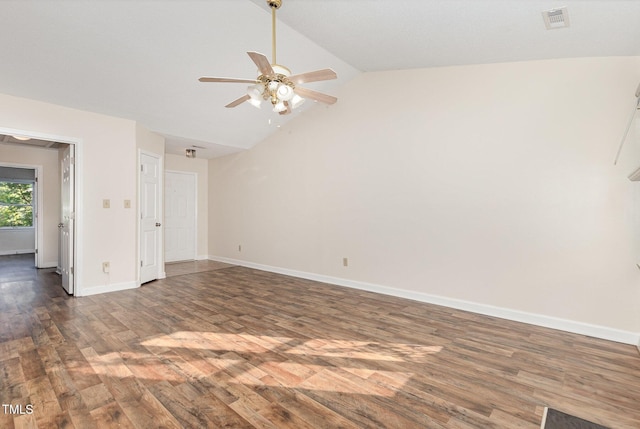 empty room featuring wood finished floors, ceiling fan, baseboards, visible vents, and lofted ceiling
