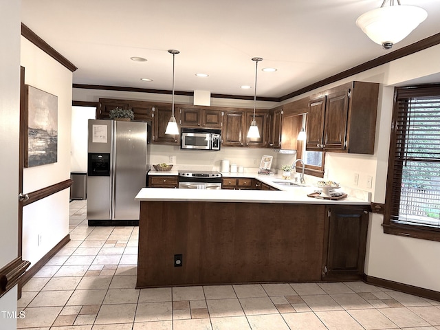 2708 Halfhitch Trl, Raleigh, NC 27615 - kitchen with appliances with stainless steel finishes, a sink, crown molding, a peninsula, and dark brown cabinets