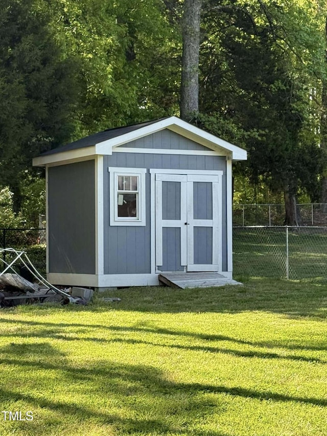view of shed with fence