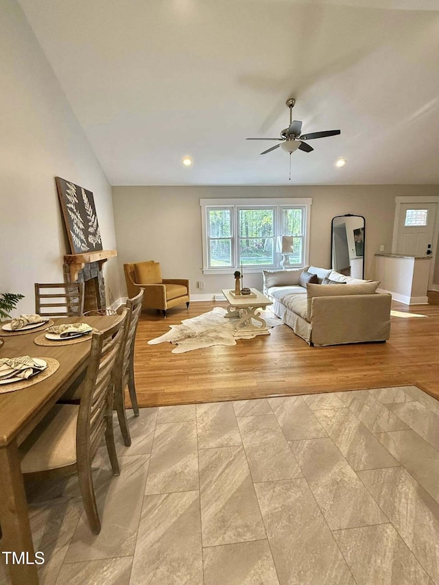 living room featuring recessed lighting, a healthy amount of sunlight, baseboards, and ceiling fan