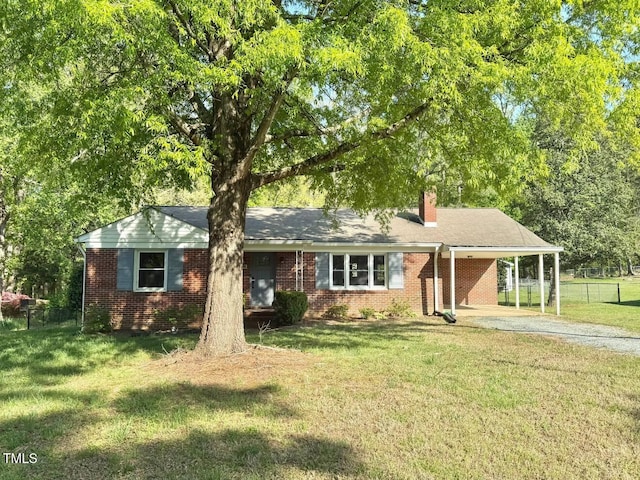 ranch-style home with a chimney, driveway, a carport, fence, and brick siding