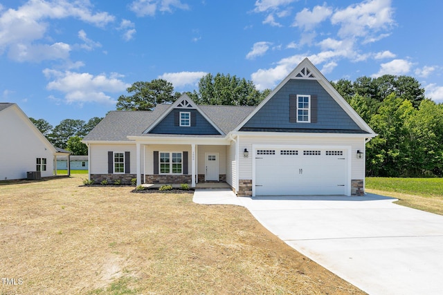 1000 Peedin Rd, Selma, NC 27576 - craftsman-style house with stone siding, a front lawn, concrete driveway, and covered porch