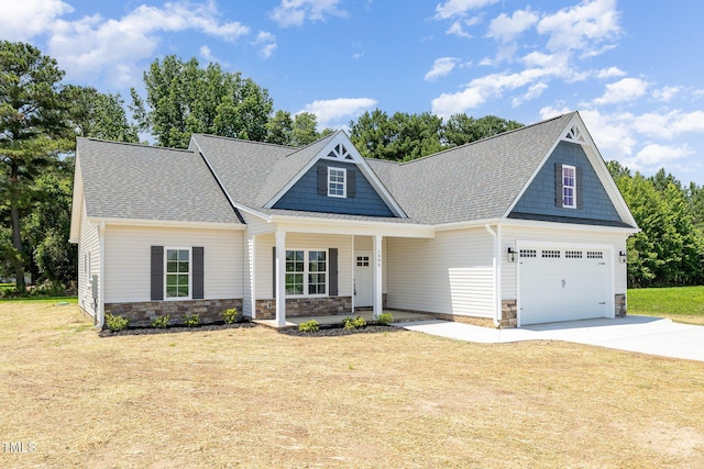 1000 Peedin Rd, Selma, NC 27576 - craftsman-style home featuring stone siding, roof with shingles, concrete driveway, and a front lawn