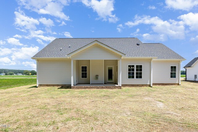 1000 Peedin Rd, Selma, NC 27576 - back of property featuring a lawn and roof with shingles